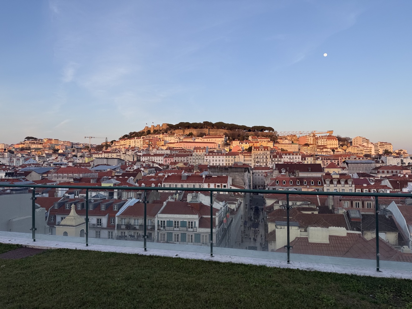 Hotel do Chiado rooftop at night, the castle over the Baixa rooftops